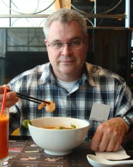 Bill grover eating prawn noodle soup